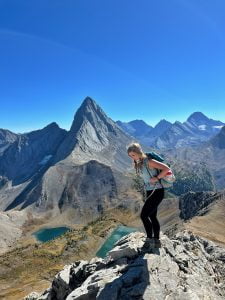 Smutwood Peak: Girl in front of jagged mountain